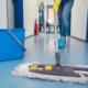 janitor mopping floor of commercial building